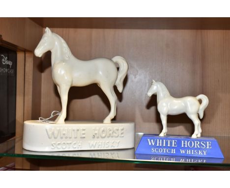 TWO WHITE HORSE SCOTCH WHISKY ADVERTISING FIGURES, comprising a white ceramic Kelsboro Ware white horse, height 21cm (has bee
