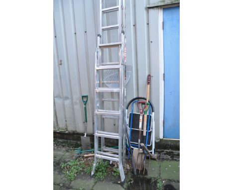 AN ALUMINIUM DOUBLE EXTENSION LADDER  with 13 rungs to each 350cm length, two step ladders and a collection of garden tools (