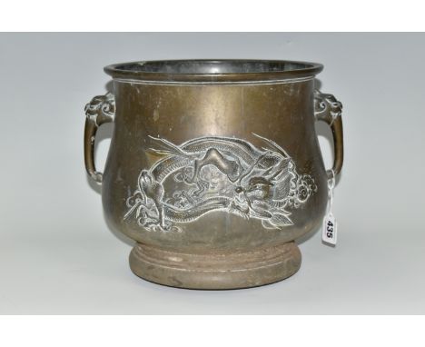 AN ORIENTAL BRONZE PLANTER, decorated with a repoussé Japanese three clawed dragon on two sides and two tiger handles, height