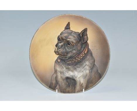 A NORITAKE WALL PLATE, decorated with a raised hand painted design of a bulldog, green back stamp R.C Noritake- Nippon Toki K