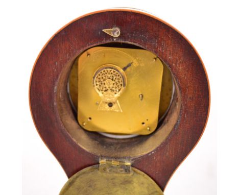 An unusual 19th century mahogany and boxwood strung sedan mantel clock, the white enamel dial set with Roman numerals within 