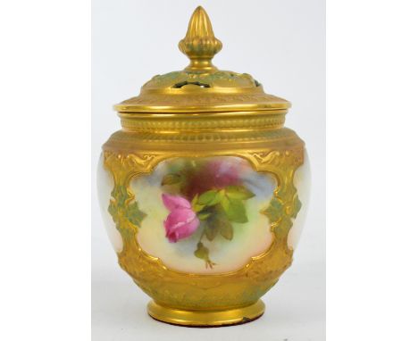 A Royal Worcester porcelain pot pourri of squat baluster form, hand painted with four opposing shaped panels depicting floral