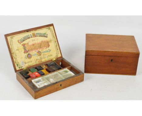 A small wooden paint box, the hinged lid with label inscribed "Colours & Materials for Illuminating and Missal Painting, Reev