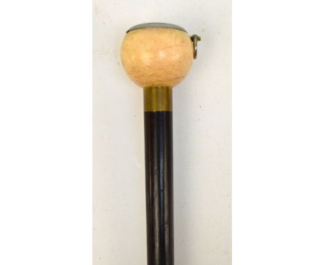 A WWI period walking cane with ebonised rosewood shafted and turned ivory handle surmounted with a fixed Dennison of Birmingh