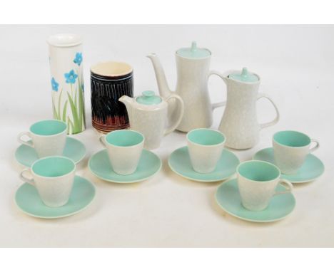 A Poole two tone coffee set comprising a coffee pot, a hot water jug, a milk jug, and six cups and saucers, also a Poole flor