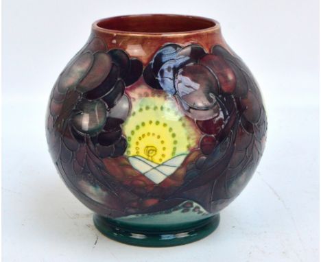 A modern Moorcroft squat baluster vase, tubeline decorated with trees and sunrise above hills in the background, impressed ma