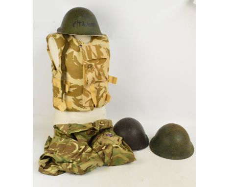 An army body armour vest, NATO size 7080/0010, a camouflage combat jacket, NATO size 8090/9095, and three helmets (two with l