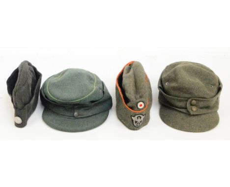 A German green cloth peaked cap with stitched badge eagle insignia, a further cloth peaked cap and two further caps, one with