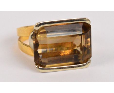 An Italian 18ct yellow gold gentleman's ring set with large radiant cut light brown topaz in high engraved and pierced decora