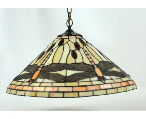 A Tiffany style ceiling lamp shade of tapering form decorated with dragonflies on cream ground, diameter 50cm.
