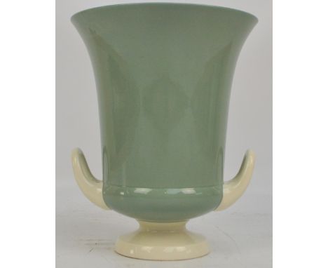 KEITH MURRAY FOR WEDGWOOD; a campana shaped celadon vase in green and cream with KM Wedgwood printed mark to base and impress