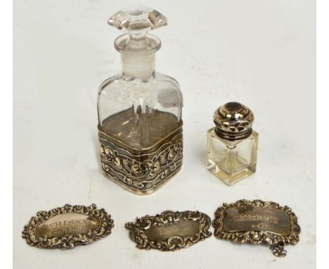 Two similarly decorated Elizabeth II hallmarked silver decanter labels; "Whisky", David Hollander & Son, Birmingham 1977, and