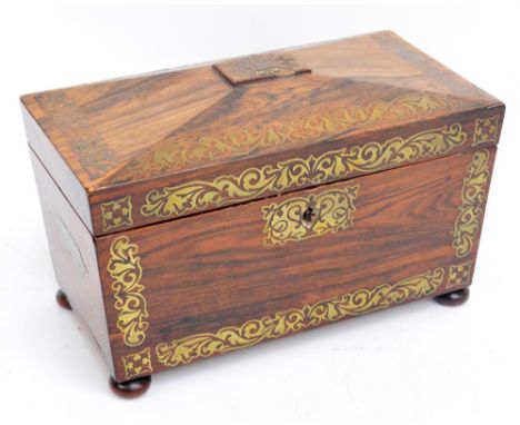 A Regency rosewood and brass inlaid tea caddy of sarcophagus form, lacking interior.