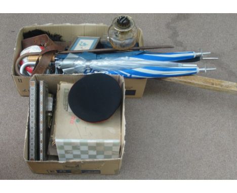 A mixed collectors' lot including an oil lamp, umbrella and shooting sticks, signed football, a military hat, various rulers,