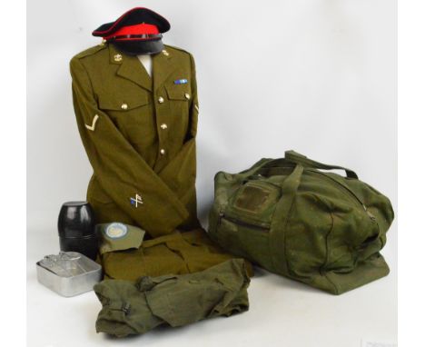 A quantity of army uniform and equipment including a khaki jacket, trousers, shirt, sweater, braces, cap, United Nations arm 