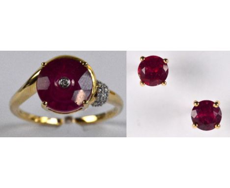 GLENN LEHRER FOR TGGC; a 10ct yellow gold ring set with round faceted ruby centred with a small diamond in claw setting with 