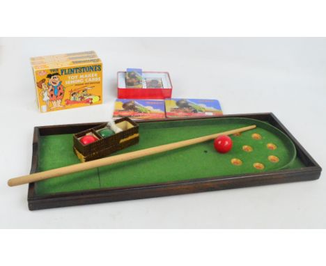 A small quantity of toys comprising a small quantity of vintage Meccano contained in a wooden box, a bagatelle game with smal