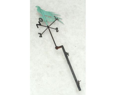 A 19th century weathervane with metal supports and stanchions, compass points, and removable rotating bird decoration, height