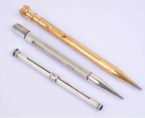 A hallmarked silver propelling pencil of hexagonal form with engine turned decoration, by JM & Co, London 1960, a further sim