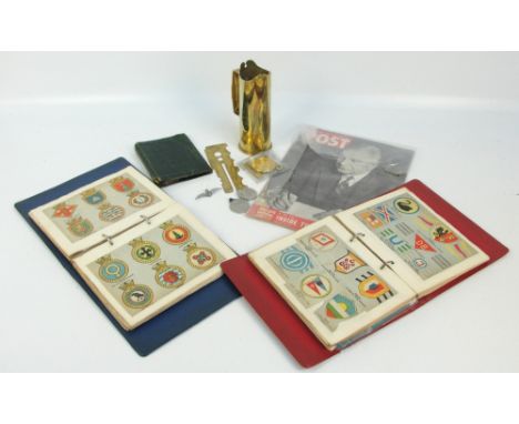 A collection of military ephemera and other military items including two scrap books of military interest including badges, u