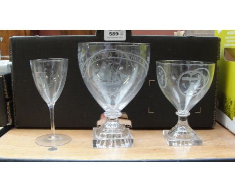 A mid 19th century stemmed drinking glass with lemon squeezer base, etched with Masonic insignia, height 13.5cm and a larger 