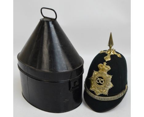 A late 19th century green cloth spiked helmet with badge inscribed "Third Vol R Battn South Staffordshire", with ring chain s
