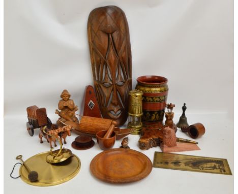 A group of various treen items including an African mask, pestle and mortar and a transfer decorated vase, also a German metr