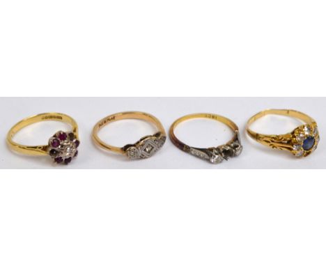 Four Victorian/Edwardian dress rings comprising a 9ct yellow gold and three stone diamond example with platinum illusion sett