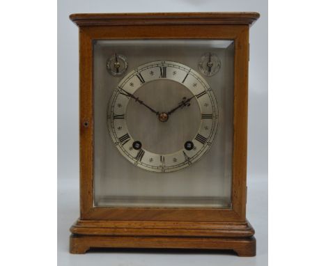 WINTERHALDER & HOFFMEIER; an early 20th century mahogany cased and glazed eight day mantel clock with silvered rectangular fa