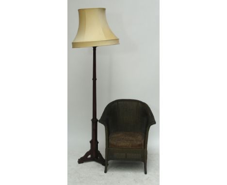 A Lloyd Loom chair and a standard lamp (2).