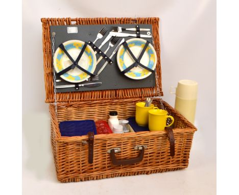 An Antler picnic hamper containing settings for four including glasses, knives, forks, spoons, shallow, bowls, picnic boxes, 