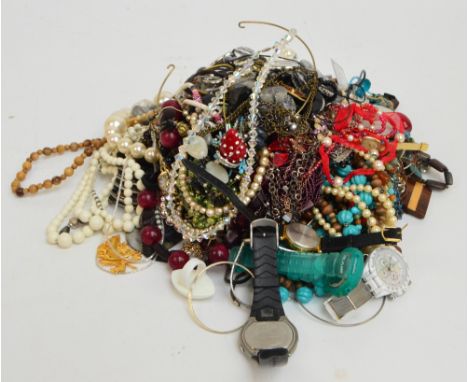 A large quantity of costume jewellery comprising various bead necklaces including simulated pearl examples, brooches includin