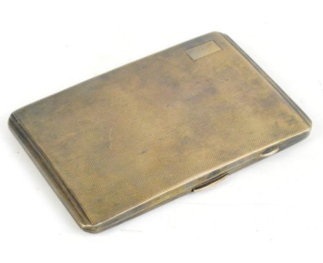 A George VI hallmarked silver Art Deco cigarette case of rounded rectangular form with engine turned decoration, stepped ends