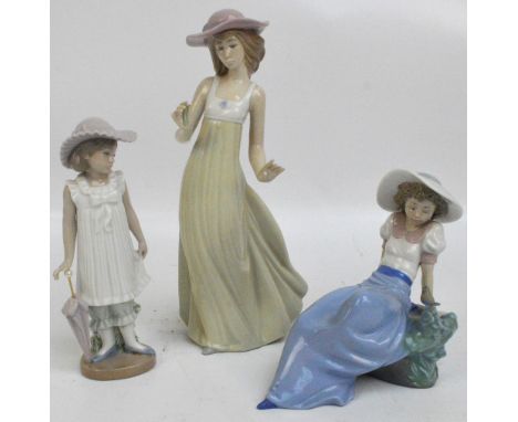 Three Nao figures comprising girl with parasol, a seated girl with bird and a woman with flower (af) (3). CONDITION REPORT: W