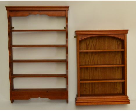 Two stained pine wall shelf units, the larger height 83cm, width 52.5cm, depth 10.5cm (2).