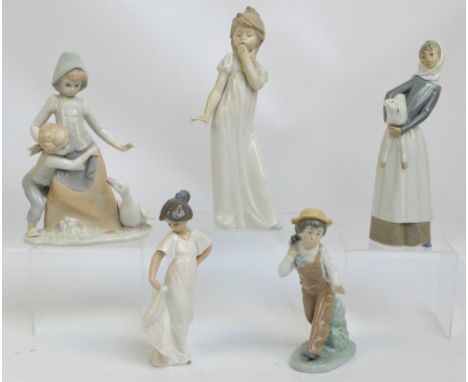 Three Nao porcelain figures to include boy carrying a puppy (af), a Lladro example of a girl with a lamb, height 27cm, and a 