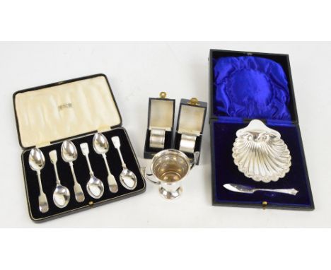 A small group of various hallmarked silver items comprising a cased George V hallmarked silver scallop moulded butter dish wi