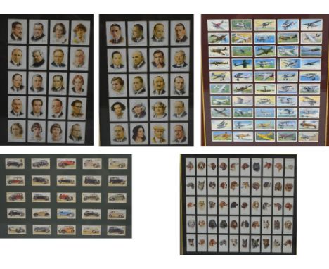 A collection of various cigarette cards including "British Birds", "Uniforms of The Territorial Army", "Celebrities of Britis