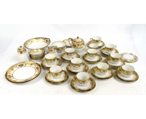 A group of Noritake porcelain teaware with gilt floral and foliate decoration on cream ground including cups and saucers, a s