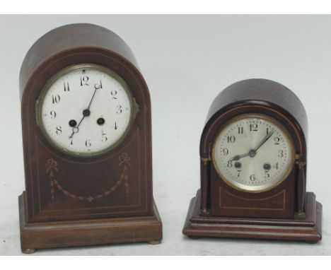 An Edwardian mahogany and inlaid eight day mantel clock with white enamel dial set with Arabic numerals, height 29cm, and a s