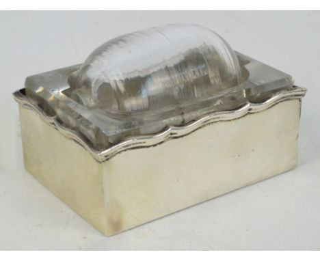 A George V hallmarked silver mounted clear glass stamp roller of rectangular form, Henry Matthews, Birmingham 1912, 5.5 x 7cm