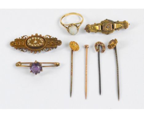 A collection of jewellery including a 15ct yellow gold mourning bar brooch with applied decoration and centred with an oval o