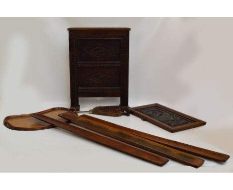 A pair of carved oak and leather bellows, a similarly decorated rectangular wall panel and fire screen, height 64.5cm, also a