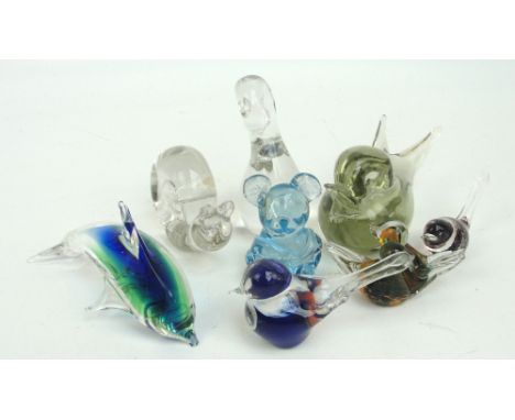 A collection of glass animals including a pale green bird signed "R Anatra", a Wedgwood clear glass snail, a dolphin by Lagun