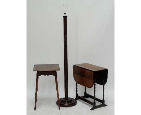 An early 20th century oak dropleaf table, a further square plain oak occasional table, and a mahogany standard lamp (3).