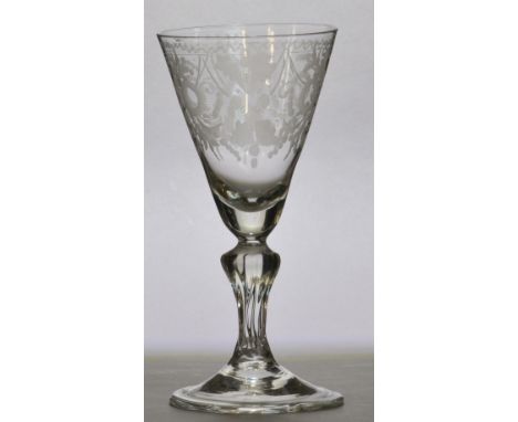 An early to mid 18th century Dutch light baluster with conical bowl engraved with baroque style foliate scrolls and roundels 