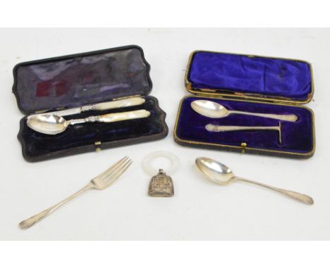 A cased Edward VII hallmarked silver spoon and push, William Hutton & Sons, London 1907/1908, a further cased hallmarked silv