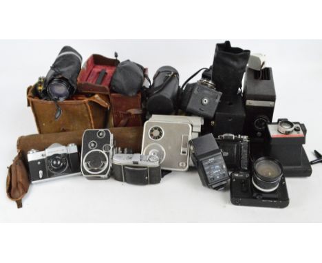 A quantity of photographic equipment including a Zeiss Icon camera, Kodak cameras, a wooden bellows slide camera, the plaque 