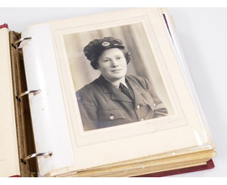 An album of early 20thC and later army related photographic portraits, some signed to include soldier from King's Regiment, a
