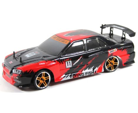 An R ! Flying Fish remote controlled HSP racing rally car, in black and red trim, 13cm high.